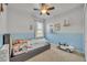 Charming bedroom features playful decor, a car-shaped nightlight, and two-toned blue paint at 15506 Gemini Dr, Mascotte, FL 34753