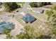 An overhead shot of a single Gathering home shows a driveway, landscaping, and an attractive new roof at 1633 Sw 168Th Loop, Ocala, FL 34473