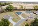 An aerial view shows three single Gathering homes in a partially developed community and the surrounding areas at 1633 Sw 168Th Loop, Ocala, FL 34473