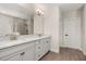 Elegant bathroom with a double vanity, granite countertops, and a large mirror at 18339 Oliver Twist Way, Winter Garden, FL 34787