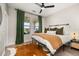 Comfortable bedroom with stylish decor, including a statement rug and views of the backyard at 18339 Oliver Twist Way, Winter Garden, FL 34787