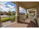 Charming front porch with brick flooring and white chairs, perfect for enjoying the outdoors at 18339 Oliver Twist Way, Winter Garden, FL 34787