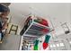 Garage with ceiling storage racks at 18339 Oliver Twist Way, Winter Garden, FL 34787