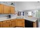 Well-lit kitchen with modern appliances, breakfast bar, and sleek countertops at 1909 Michigan Way, Poinciana, FL 34759