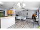 Bright living room featuring modern decor, vaulted ceiling, and easy access to the kitchen at 1909 Michigan Way, Poinciana, FL 34759