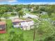 Overhead view of a house with solar panels, a large green backyard, and the surrounding neighborhood at 23 Judith Ln, Orlando, FL 32811