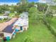 Aerial shot of the house showing solar panels and a spacious green backyard with a house extension at 23 Judith Ln, Orlando, FL 32811