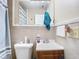 Bathroom with neutral toned tile, a wood vanity and standard toilet at 23 Judith Ln, Orlando, FL 32811