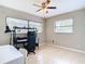 Bedroom with tile floor, ceiling fan, and bright natural light at 23 Judith Ln, Orlando, FL 32811