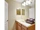 Bathroom featuring a vanity with wood cabinets, sink and mirror, and tile flooring at 2383 Victoria Dr, Davenport, FL 33837