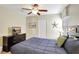 Bedroom with a ceiling fan, closet and dresser with tv on top of it at 2383 Victoria Dr, Davenport, FL 33837