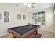 A spacious game room offers a pool table and custom artwork on the walls at 2383 Victoria Dr, Davenport, FL 33837