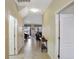 Inviting hallway with tile flooring and neutral walls, leading to the living spaces at 2383 Victoria Dr, Davenport, FL 33837