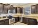 A closer view of the kitchen showcasing stainless steel appliances and granite countertops at 2383 Victoria Dr, Davenport, FL 33837