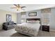 Relaxing main bedroom features a sitting area and coordinated decor at 2383 Victoria Dr, Davenport, FL 33837