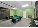 Game room with pool table, air hockey table and more at 2483 Dubai St, Kissimmee, FL 34747