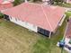 Aerial view of the home's tile roof and manicured backyard with screened-in patios at 2625 Albion Ave, Orlando, FL 32833