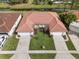 Aerial view of two homes, each with two-car garages and manicured lawns at 2625 Albion Ave, Orlando, FL 32833