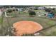 Overhead of the fenced in ball field with a walking path and green space in background at 2625 Albion Ave, Orlando, FL 32833