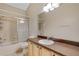 Bathroom featuring a shower-tub combo, a vanity, and tile flooring at 2625 Albion Ave, Orlando, FL 32833