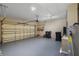 Spacious two car garage with epoxy floor, shelving, and overhead lighting at 2625 Albion Ave, Orlando, FL 32833