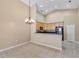 Spacious dining room with vaulted ceilings adjacent to kitchen with breakfast bar at 2625 Albion Ave, Orlando, FL 32833