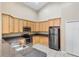 Modern kitchen with stainless steel appliances, granite countertops and light wood cabinetry at 2625 Albion Ave, Orlando, FL 32833