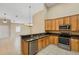 Modern kitchen with stainless steel appliances adjoined to the living room at 2625 Albion Ave, Orlando, FL 32833