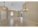 Bright, airy living room with neutral tile flooring and sliding glass doors to the outdoor area at 2625 Albion Ave, Orlando, FL 32833