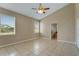 Main bedroom featuring tile flooring, a ceiling fan, and lots of natural light at 2625 Albion Ave, Orlando, FL 32833