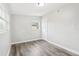 An empty bedroom with wood-look flooring and natural light at 2934 Truman Blvd, Sanford, FL 32771