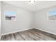 Bright bedroom features wood-look flooring and neutral walls, creating a modern, calming space at 2943 Truman Blvd, Sanford, FL 32771