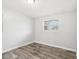 An empty bedroom with wood-look flooring and a window at 2943 Truman Blvd, Sanford, FL 32771