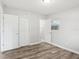 An empty bedroom with wood-look flooring, closets and natural light at 2943 Truman Blvd, Sanford, FL 32771