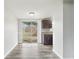 Bright dining space featuring sliding glass doors, neutral walls, and elegant vinyl flooring at 2943 Truman Blvd, Sanford, FL 32771