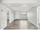 Bright and airy living room with modern gray walls, wood-look flooring, and natural light at 2943 Truman Blvd, Sanford, FL 32771