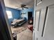 Cozy bedroom features a ceiling fan, area rug and cool blue walls at 3430 Kathy Ct, Lakeland, FL 33810