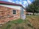 Home exterior showing brick and siding and well-maintained HVAC system at 3430 Kathy Ct, Lakeland, FL 33810