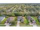 An aerial view of the homes in the community with a view of the golf course at 3819 Breckinridge Ln, Clermont, FL 34711