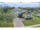 Beautiful two-story home featuring a brick-paved driveway, two-car garage, and manicured lawn at 3819 Breckinridge Ln, Clermont, FL 34711