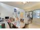 Dining area and living room with neutral carpeting, staircase and lots of natural light at 3819 Breckinridge Ln, Clermont, FL 34711