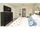 Bedroom featuring a dark dresser with television, and ensuite access to the bathroom and walk-in closet at 3987 Silverstream Ter, Sanford, FL 32771