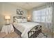 Charming bedroom with patterned bedding, stylish lamps, and elegant decor at 3987 Silverstream Ter, Sanford, FL 32771