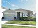 Charming single-story home with a well-manicured lawn, two car garage and tidy landscaping at 3987 Silverstream Ter, Sanford, FL 32771