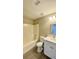 Clean bathroom featuring a white vanity, bathtub with shower, and neutral colors at 425 Cadenza Dr, Orlando, FL 32807