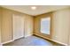 Cozy bedroom with laminate floors, closet, and natural light at 425 Cadenza Dr, Orlando, FL 32807