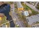 Aerial view of condo complex showcasing landscaping, community pool, and ample parking at 4536 Commander Dr # 1537, Orlando, FL 32822