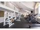 Well-equipped fitness center featuring modern exercise machines, high ceilings, and abundant natural light at 4536 Commander Dr # 1537, Orlando, FL 32822