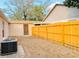 Backyard featuring a new wood fence, an outbuilding, and an A/C unit at 459 Wood Rose Ln, Altamonte Springs, FL 32714