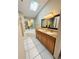 Bathroom with dual sink vanity, soaking tub, and tile flooring at 459 Wood Rose Ln, Altamonte Springs, FL 32714